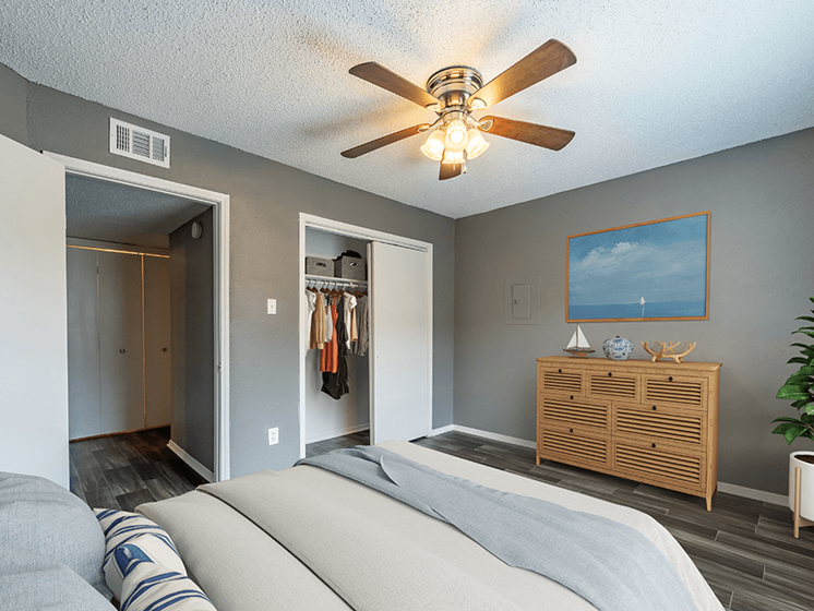 large bedroom with wood-style flooring and large closet
